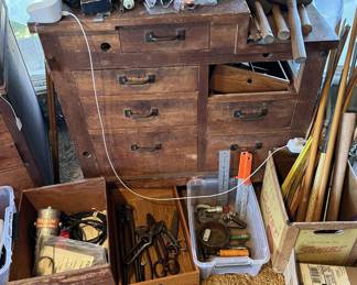 There are mallets and hammers, as well as squares and rulers here.