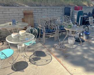 Here is another set of patio furniture, including more chairs and a couple of glass-topped tables.