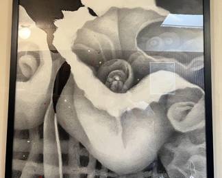 There are several framed artwork pieces in the sale.  This is one of them.