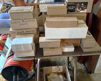 A number of the tools are stored in their boxes.