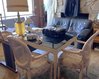 Here is a good look at a glass-top dining table and chairs (as far as I can tell, the chairs are not "glass-topped".  They have cushions).