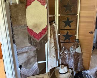 A selection of brand new cowhide runners and rugs