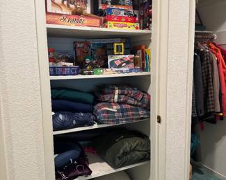 Hallway, games, blankets sheets, sleeping bag