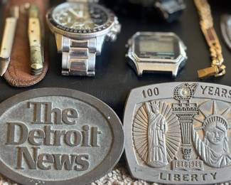Detroit news and centennial belt buckle