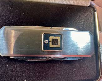  men’s grooming knife( scissors, file,knife) made in Japan has a little diamond and 12 gold karat platform for the diamond.