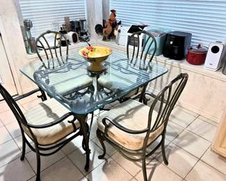 Kitchen glass and metal table with 4 chairs