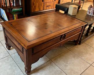  This item is a  coffee table with a lift top