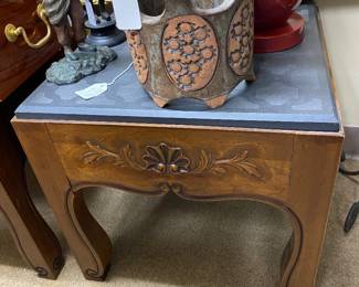 Matching Drexel stone top side tables with ornate carvings.