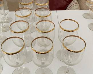 Gold-rimmed clear crystal glassware