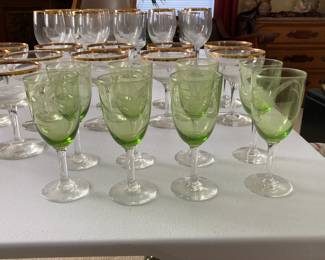 Etched "Wheat Pattern" green stemware and gold-rimmed clear crystal