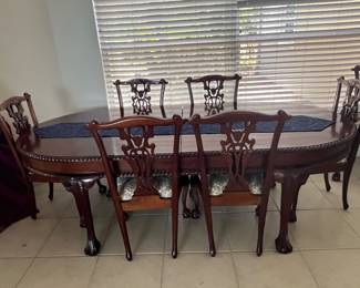 Very large table with 8 chairs and one leaf chippendale style mahogany 