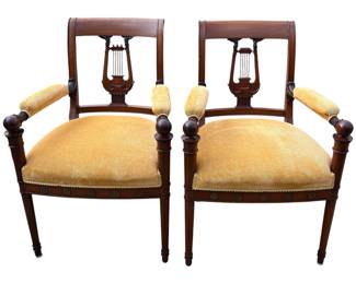 A good pair of carved Regency armchairs with lyre backs