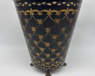 Black and gold metal wastebasket