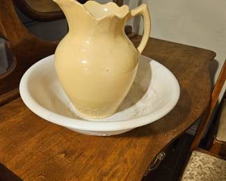Antique water basin and pitcher. She wasn't particularly concerned with matching some items. In fair condition with crazing and a glaze bubble.