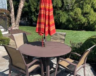 Striped Red and Orange Patio Umbrella with Table 