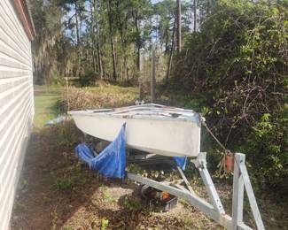 Sailboat, accessories in garage