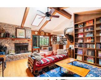 Curated mid-century interiors with custom pieces, rare vintage decor, sculptural wood furniture, and atomic-era design throughout.