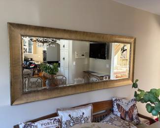 Long rectangular mirror with simple, modern gold frame