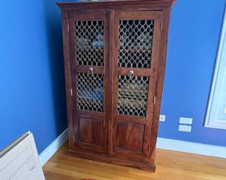 Medium sized storage chest, armoire with brass wire doors, full of games
