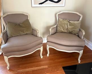 A pair of Louis XV style Burger type armchairs with ivory finish and grayish lavender upholstery 