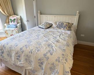 Queen sized bed with ivory farmhouse, coastal chic style headboard