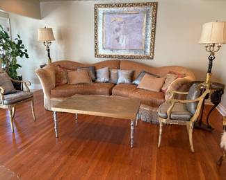 A large, curved French style sectional in two pieces, could be used as a pair of chaise lounges