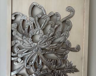 A pair of carved wood floral pictures in silver and ivory