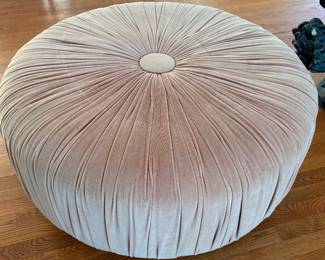 Tufted ottoman covered in pale lavender velvet
