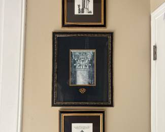 Black and white architectural and classical prints in black and gold frames