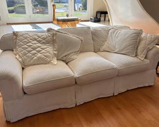 Ivory club style sofa with scrolled arms