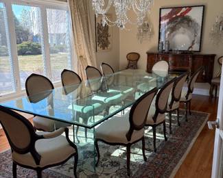 A large glass dining table, a pair of Louis XV armchairs, 6 Louis XV style side chairs