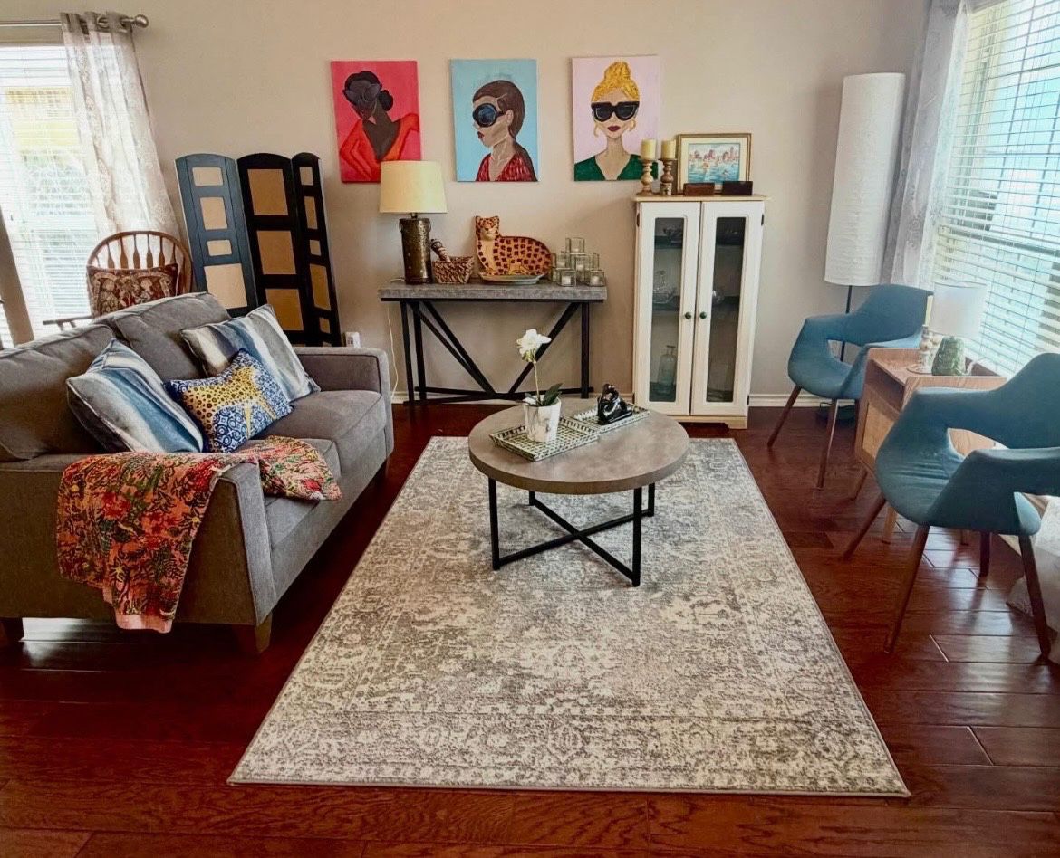 gray sofa, modern coffee table, white cabinet with blue shelves, console table, modern side chairs, floor lamp
