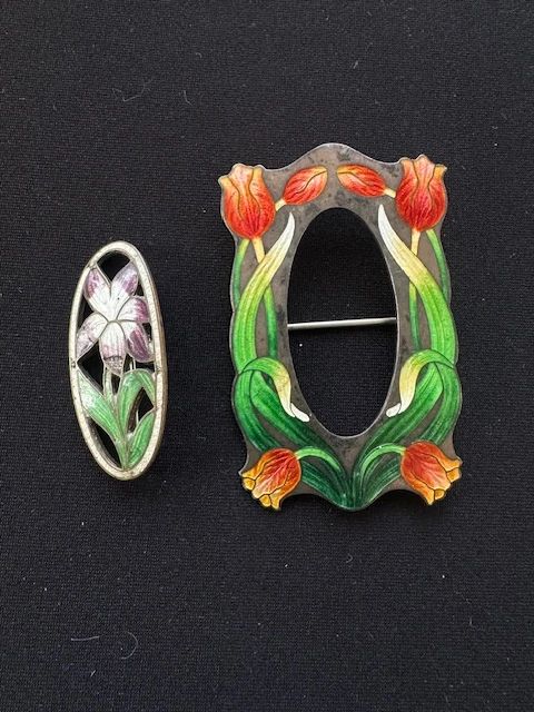 Antique enamel and sterling brooches.