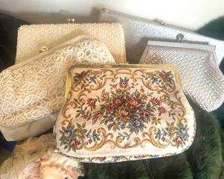 Collection of vintage evening purses, including tapestry clutch and beaded.