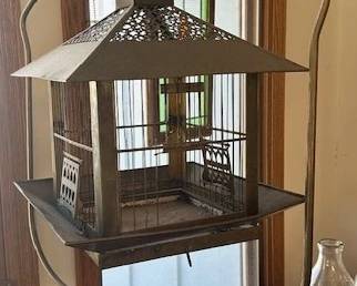 Antique brass and metalwork roof floor standing bird cage.