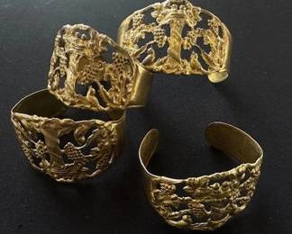 Vintage gold-toned cuff bracelets.