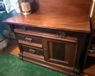 Antique server or buffet cabinet.