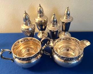 Sterling Silver salt and pepper shakers, cream and sugar.