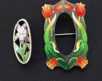 Antique enamel and sterling brooches.