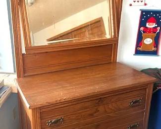 Antique English oak dresser featuring a titling beveled mirror and 3 drawers.