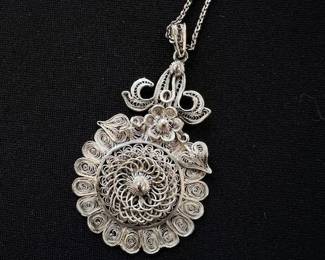 Sterling Silver filigree flower pendant with chain.