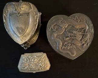 Antique decorative metal trinket boxes.