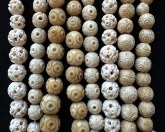 Vintage Art Deco carved bovine bone bead necklace.