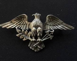 Silver-toned American eagle brooch.