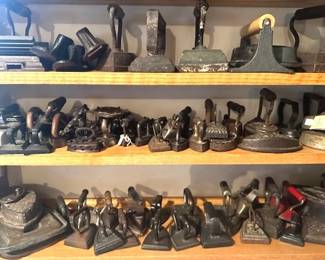 Collection of antique  cast iron "sad irons" also known as flat irons.
