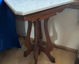 Victorian Eastlake style parlor table with marble top.