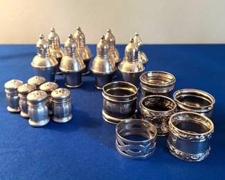 Sterling Silver salt/pepper shakers and napkin rings.