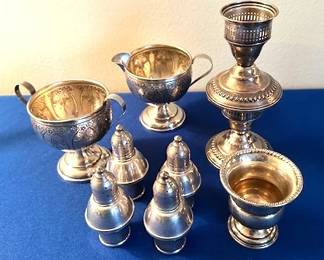 Sterling Silver salt and pepper shakers, cream / sugar, candlestick holders and cup.