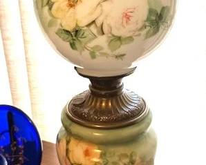 Vintage "Gone with the Wind" style parlor lamp featuring green painted glass globe and base.