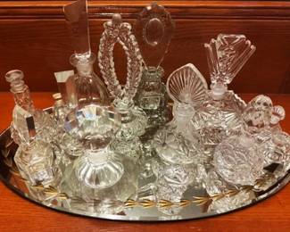 Collection of crystal and glass perfume bottles.